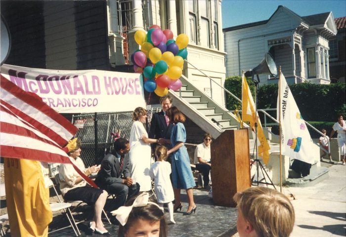Linda Howell at the Ronald McDonald San Francisco House Opening in 1989: Colorful outdoor celebration with balloons and a crowd in front of a Ronald McDonald House San Francisco banner.