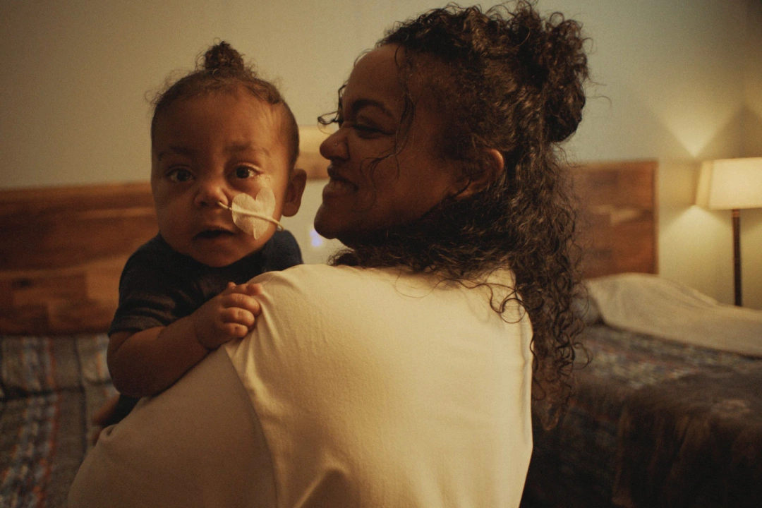 A mother holds her child